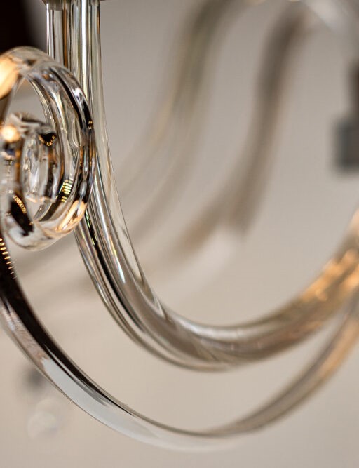 Glass arms bended by craftsmen.