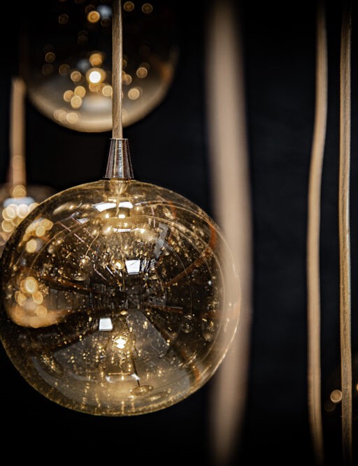 With clear of amber glass spheres.