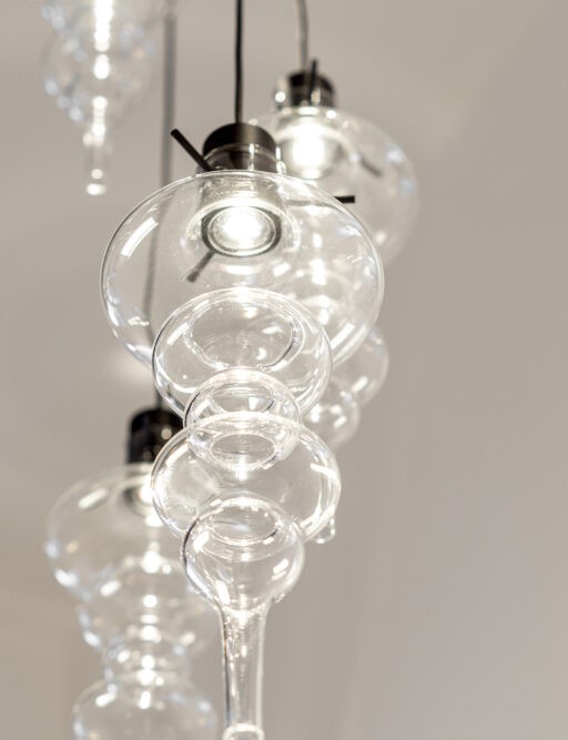 The light floats through the unique shape of the mouth-blown glass.