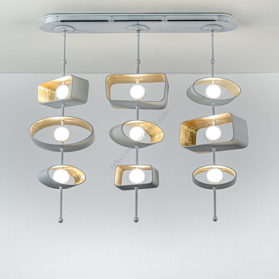 Linear Pendant lamp / Finish: Cloud / Inside Shade Finish: 22k Yellow Gold Leaf / Configurations (size): 3 Stems/3 Cast Forms (cm.: 104.1 x 95.3 x 15.2 / inch.: 41" x 37.5" x 6") / Form Composition: Mixed (Trapezoid + Oval)